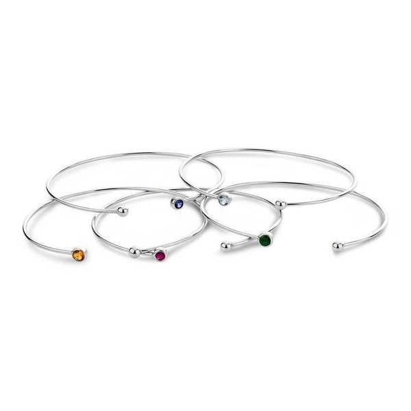 A set of sterling silver bangles with colored stones.