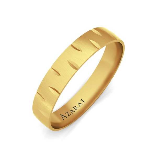A gold ring with a pattern on it.