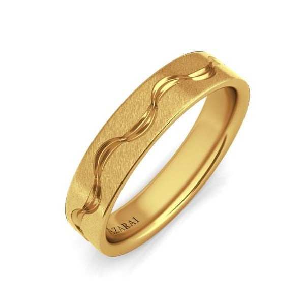 A gold ring with a wave design.