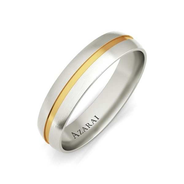 A men's wedding ring in two tone gold and white gold.