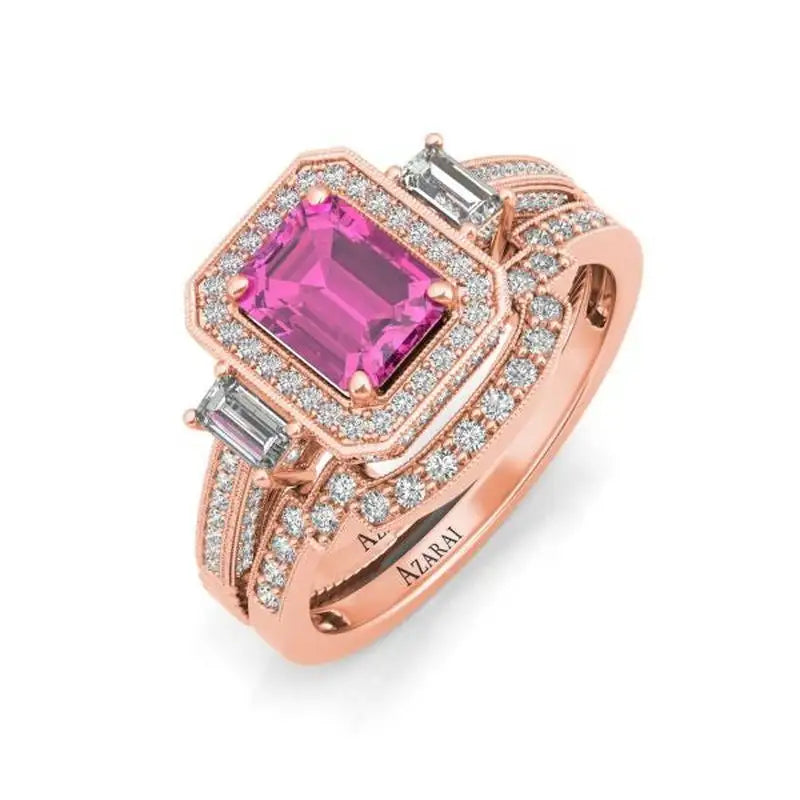 Rose gold ring set with a rectangular pink gemstone centerpiece, flanked by baguette diamonds and surrounded by rows of small round diamonds.