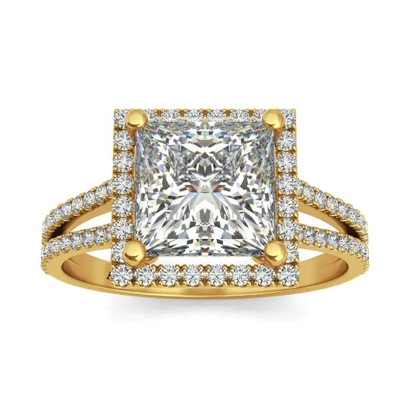 A gold ring with a large square-cut center diamond, surrounded by smaller diamonds on the band and setting.