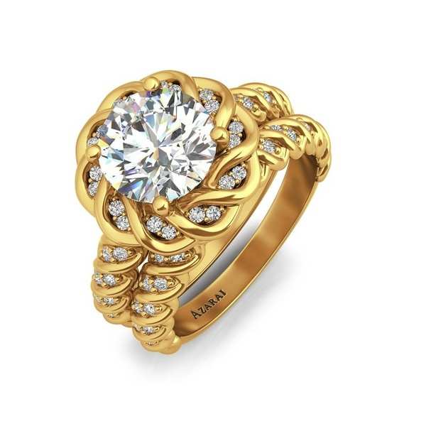 A yellow gold bridal engagement set with a twist rope shoulder