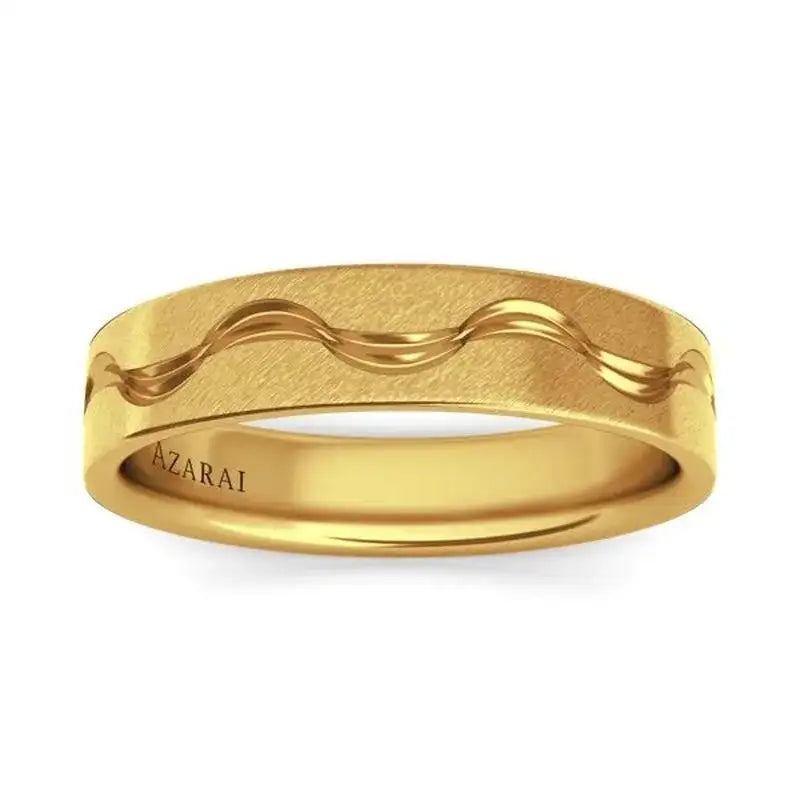 A gold ring with a matte finish, featuring a polished wavy line design around the center and the word "AZARAI" engraved on the inner band.