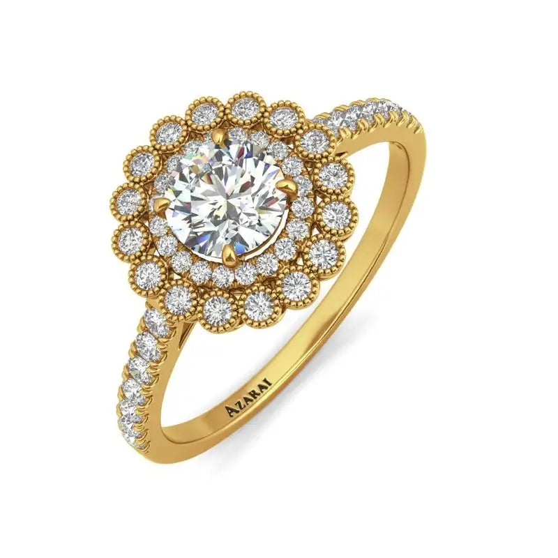 Gold ring with a central round diamond surrounded by two halos of smaller diamonds; additional diamonds line the band.