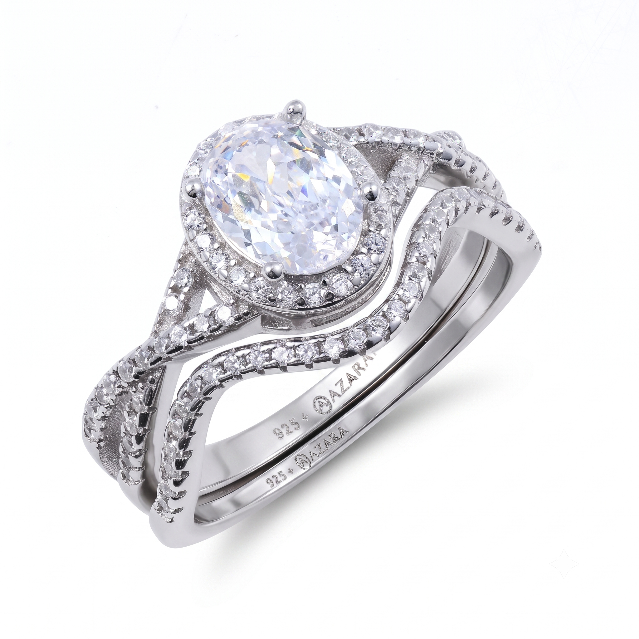 Two sterling silver rings from the Camille sterling silver bridal set, featuring oval-shaped center gemstones and small accent stones, marked "925 AZARA," elegantly displayed on a white background.
