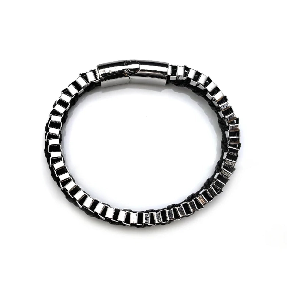 The Dualex Leather Chain Men's Bracelet features a silver and black rectangular link design with a clasp, crafted from dual materials, and is displayed in a circular shape on a white background.