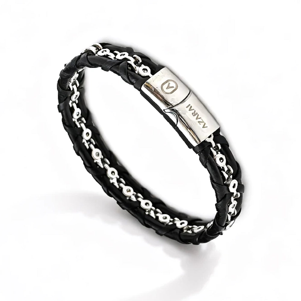 The Entwine Leather Chain Men's Bracelet features black braided leather, a central stainless steel anchor chain, and a metallic clasp engraved with ZANAAV.