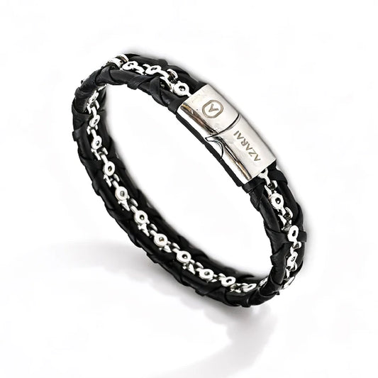 The Entwine Leather Chain Men's Bracelet features black braided leather, a central stainless steel anchor chain, and a metallic clasp engraved with ZANAAV.