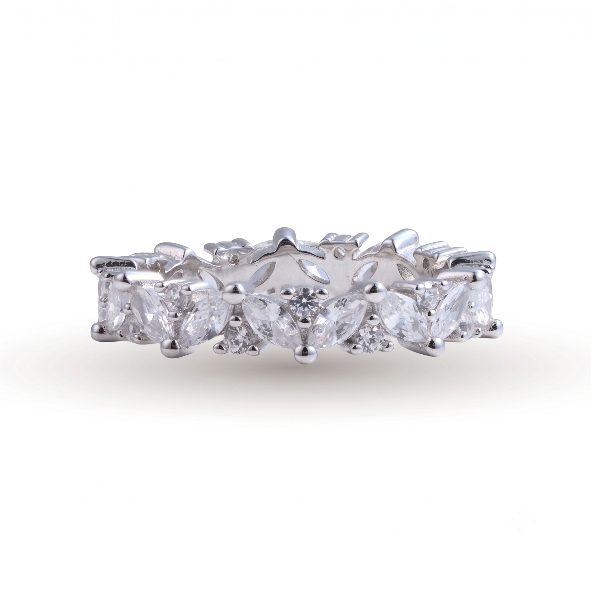 Introducing the Gipsy sterling silver wedding band, showcasing marquise and round-cut clear gemstones in an alternating pattern, beautifully set against a white background.