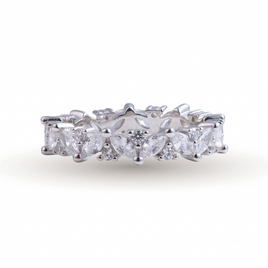 Introducing the Gipsy sterling silver wedding band, showcasing marquise and round-cut clear gemstones in an alternating pattern, beautifully set against a white background.