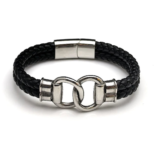 The Hinge Braided Leather Men's Bracelet features black braided leather, a stainless steel infinity link, interlocking clasp, and a metallic magnetic closure.