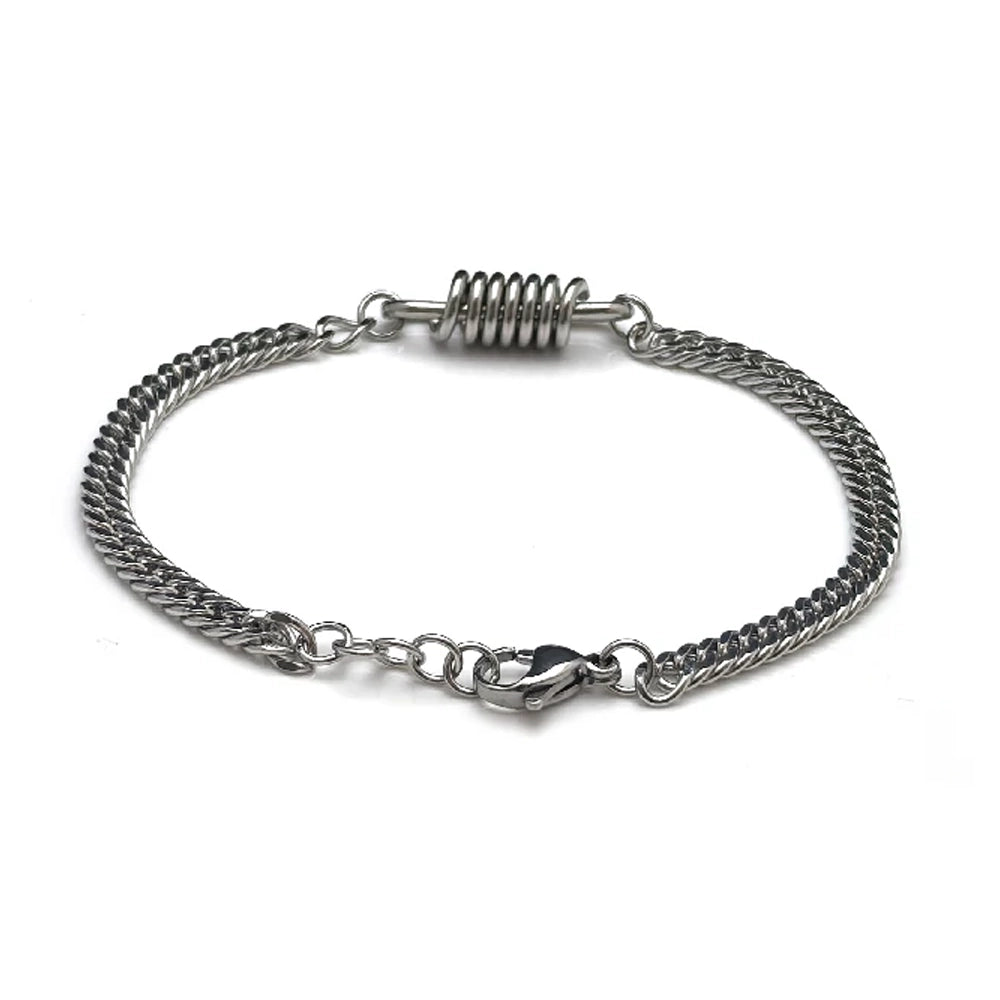 The Ignition Stainless Steel Men's Bracelet features a double chain design, lobster clasp, and coil-shaped center accent, all displayed on a white background for an automotive-inspired look.