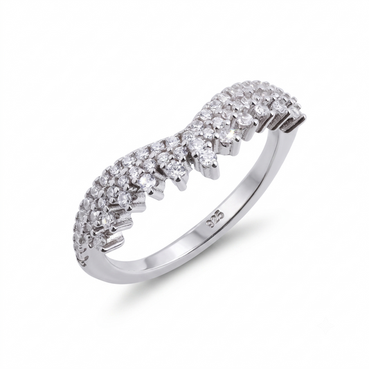 Introducing the Meira sterling silver wedding band, featuring a wavy band design adorned with multiple small round white gemstones set across the top half.