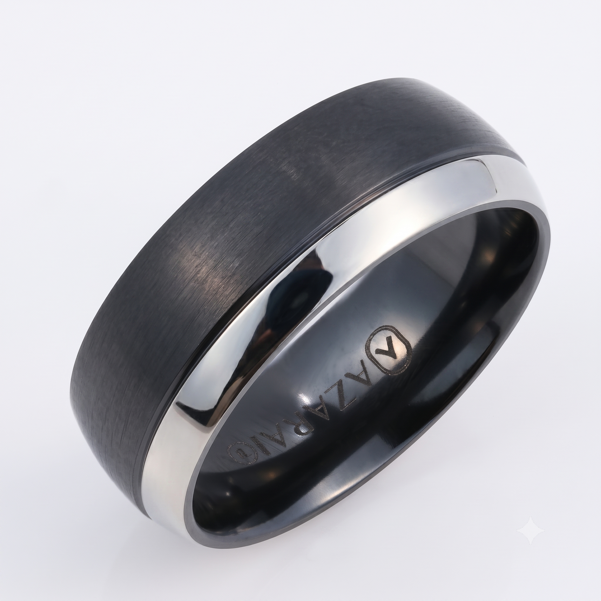 The Oakland black titanium wedding band, featuring a matte black finish with a polished silver edge and engraved with "ALAZA ANG" on the inside, is displayed against a plain white background.