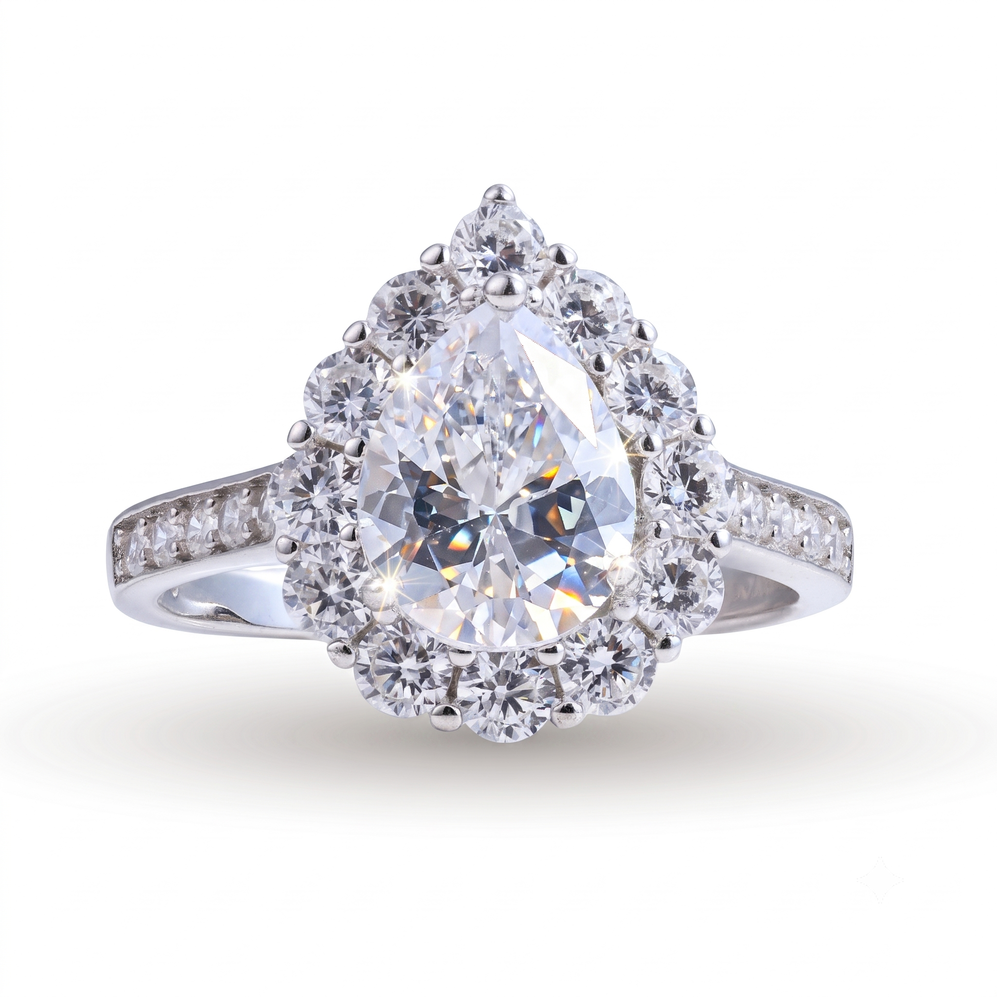 The Oriana sterling silver engagement ring showcases a pear-shaped diamond encircled by a halo of round diamonds, with a band adorned with delicate accent stones—all expertly crafted in radiant sterling silver. This stunning ring blends timeless elegance with contemporary style.