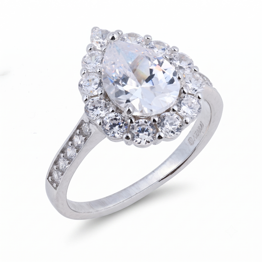Certainly! Here’s the rewritten sentence using the given product data: The Oriana sterling silver engagement ring showcases a pear-shaped central gemstone encircled by round clear stones and accented with smaller stones set gracefully along the band.