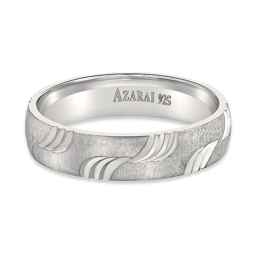 A Breton sterling silver wedding band with a wave design.
