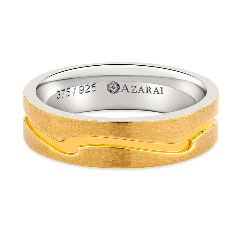 A Warwick 9kt gold and silver wedding band with a wave pattern on it.