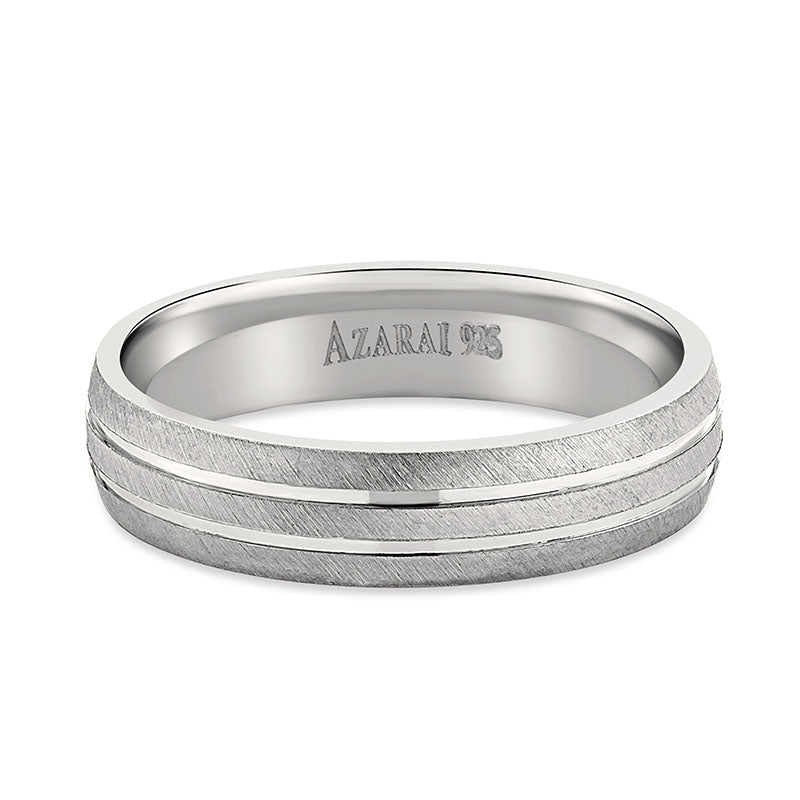 A Winston sterling silver wedding band in white gold.