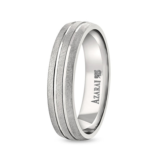 A Winston sterling silver wedding band with two rows of diamonds.