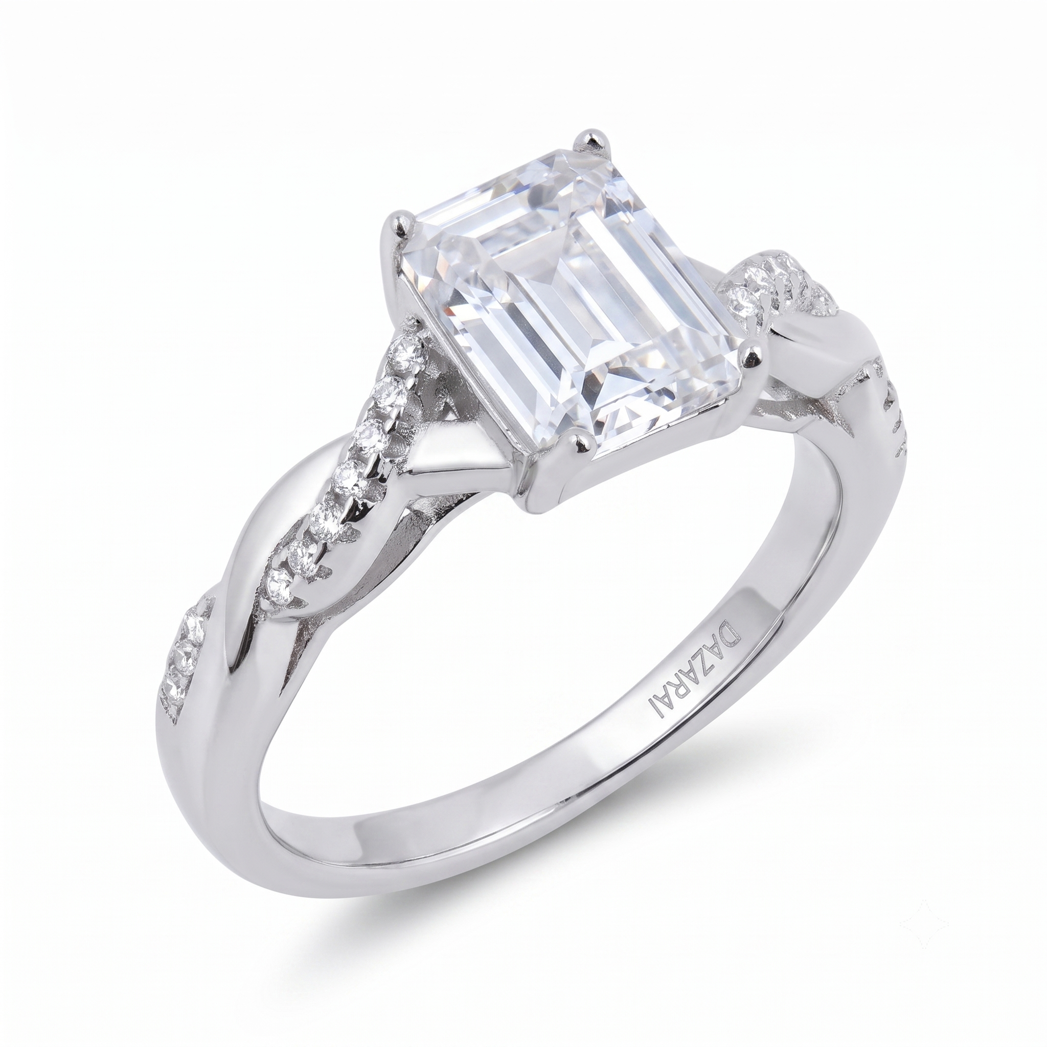 A sterling silver Sia Emerald engagement ring featuring an emerald-cut center stone with smaller diamonds set along the twisted band, perfect for an elegant proposal.