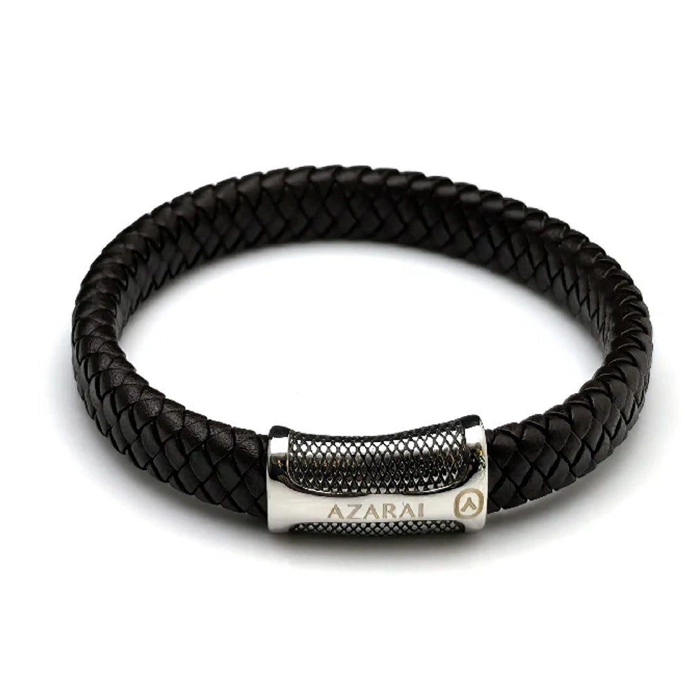 The Treso Braided Leather Men's Bracelet features dark brown braided leather and a stainless steel bar clasp engraved with "AZARAI" and a logo, making it a stylish accessory for men.
