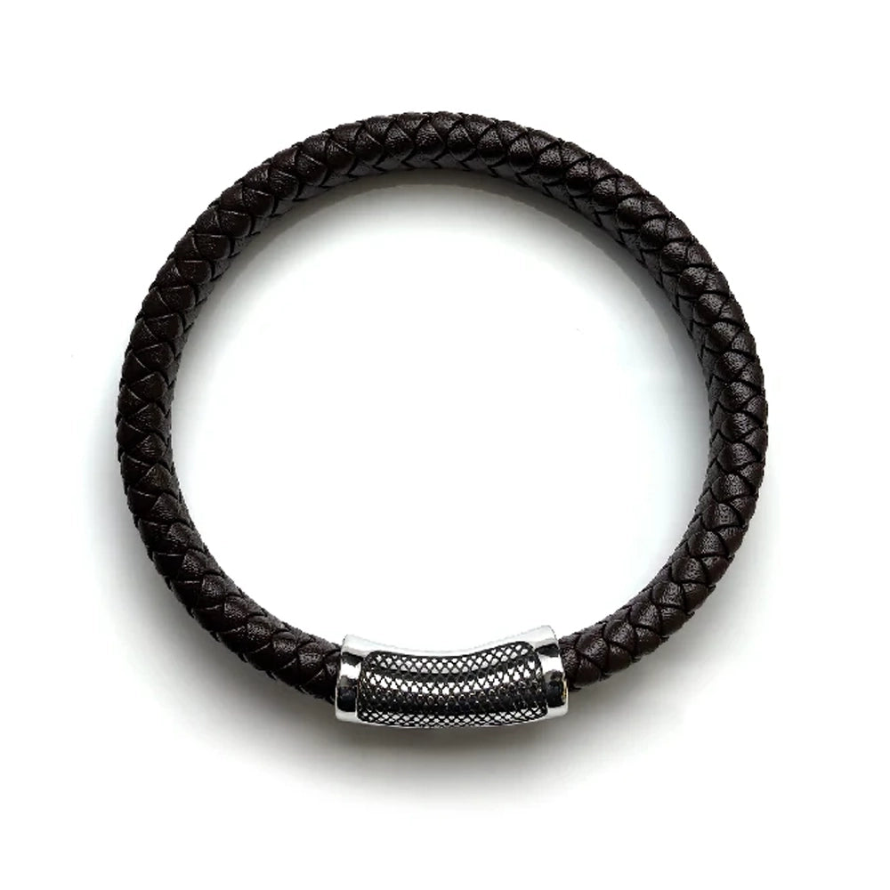 The Treso Braided Leather Men's Bracelet features dark brown braided leather and a silver textured clasp, displayed in a circular shape on a white background.