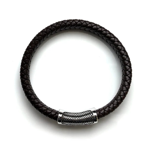 The Treso Braided Leather Men's Bracelet features dark brown braided leather and a silver textured clasp, displayed in a circular shape on a white background.