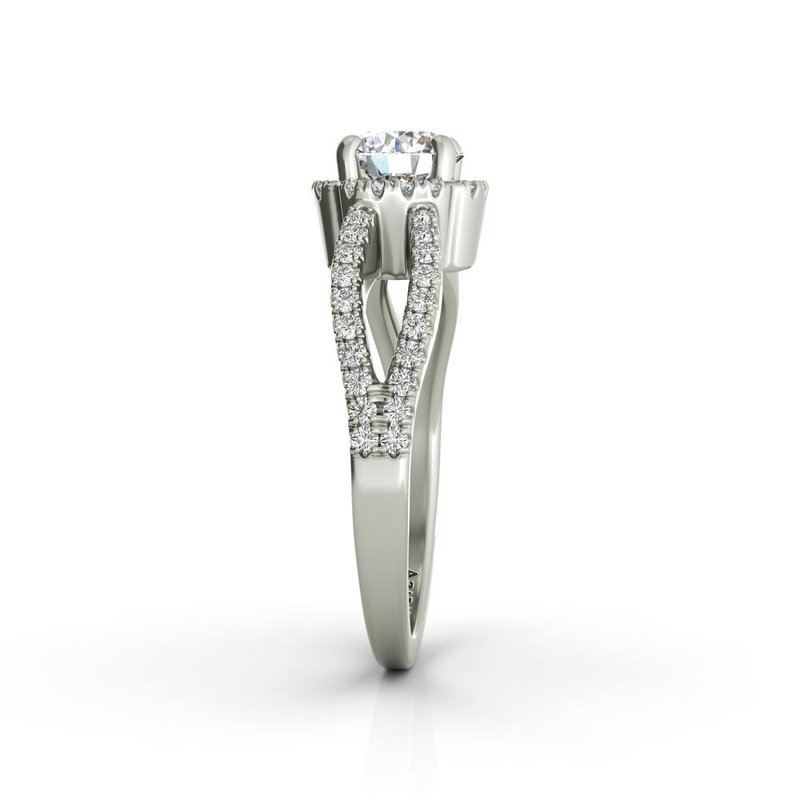 An Angelika sterling silver engagement ring with a round diamond in the center.