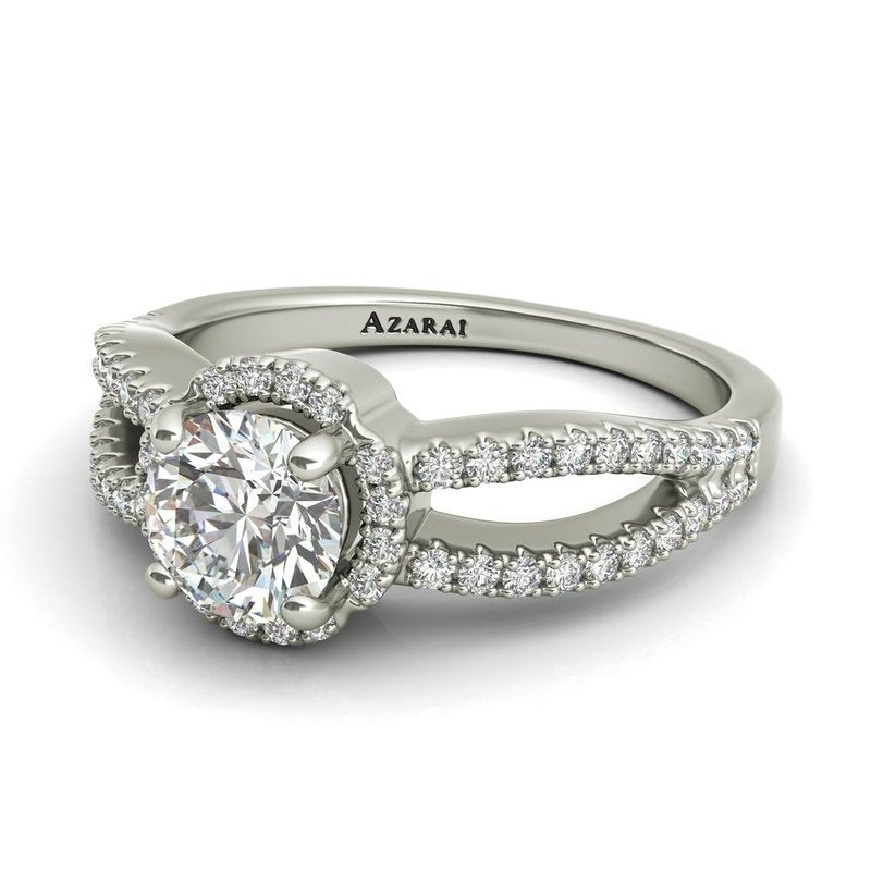An Angelika sterling silver halo engagement ring with diamonds.