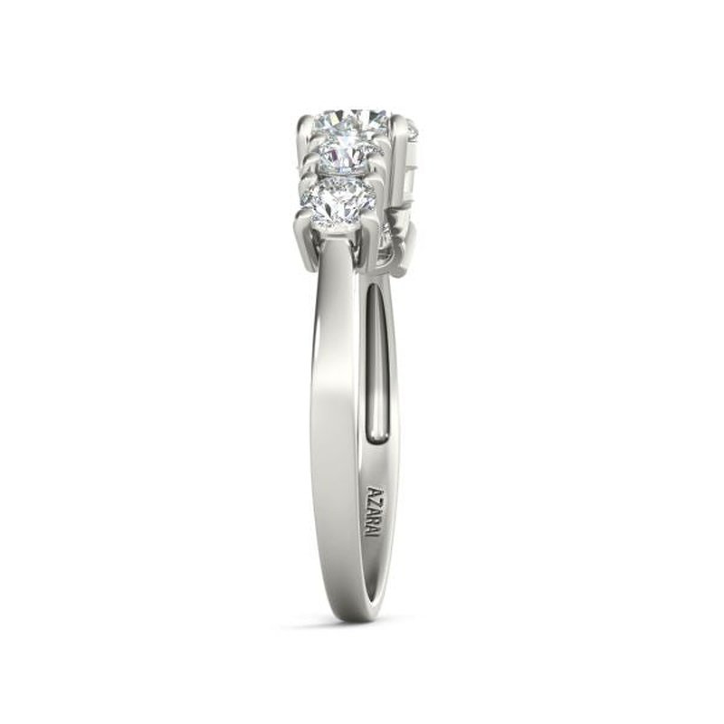 A Circa 9kt gold engagement ring with an oval cut diamond.