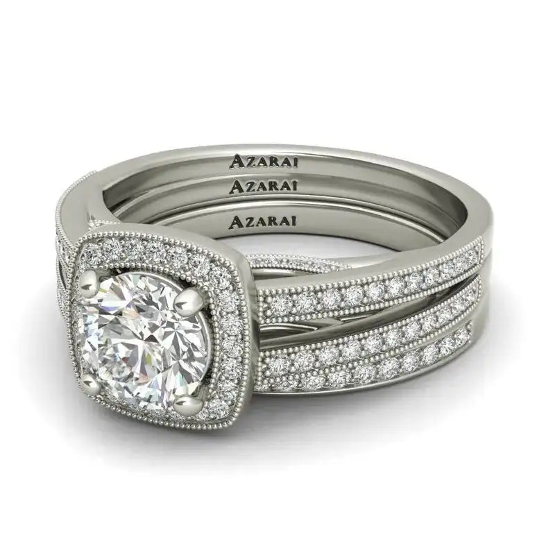 Elegant Eva sterling silver bridal set featuring a round-cut center diamond, pavé bands, and "AZARAI" engraved inside each ring—a stunning choice for silver bridal jewelry lovers.