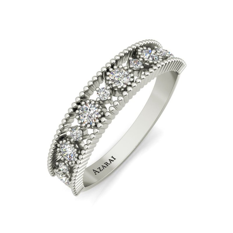 A white Isolde 9kt gold wedding band with diamonds in the center.