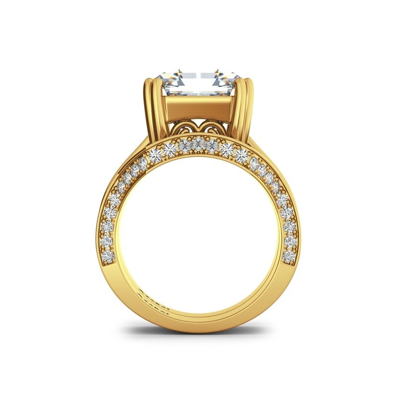 A Magna 9kt gold bridal set with a central large diamond and smaller encrusted diamonds on the band, displayed on a white background.