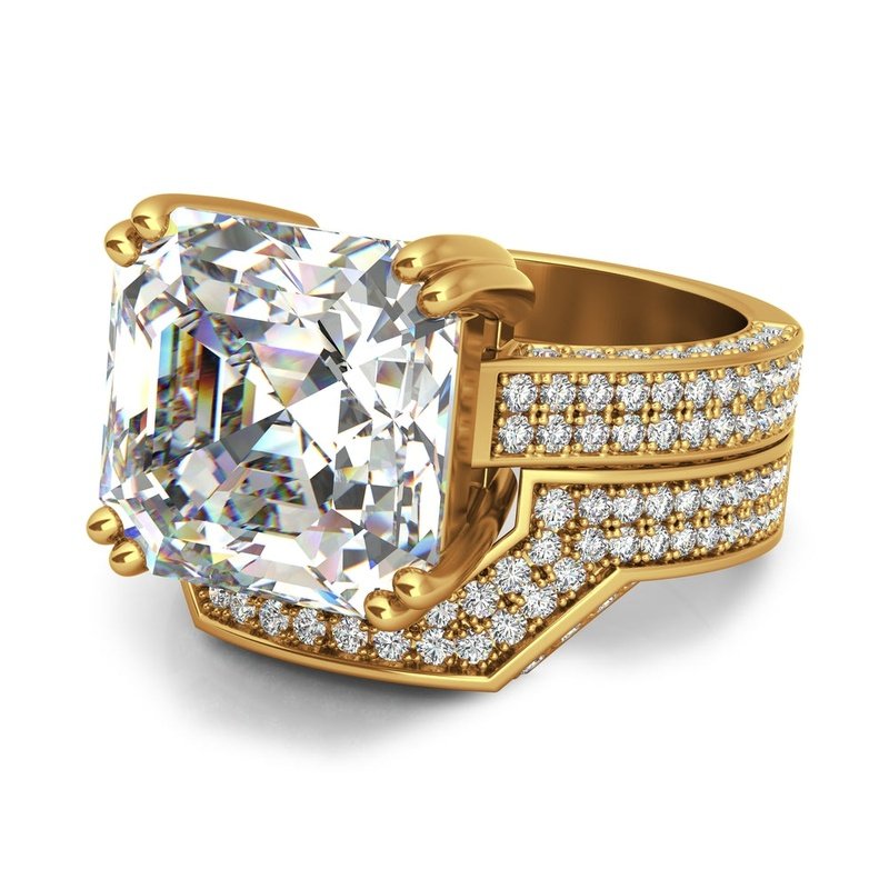 Sentence Using Product Name: The Magna 9kt gold bridal set features a large, rectangular-cut diamond set in the ring, adorned with multiple smaller diamonds on the band.