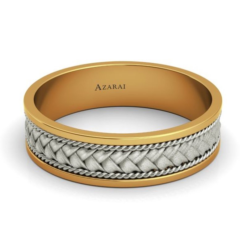 A men's Patagonia 14kt gold wedding band with a braided design made of 14kt gold.