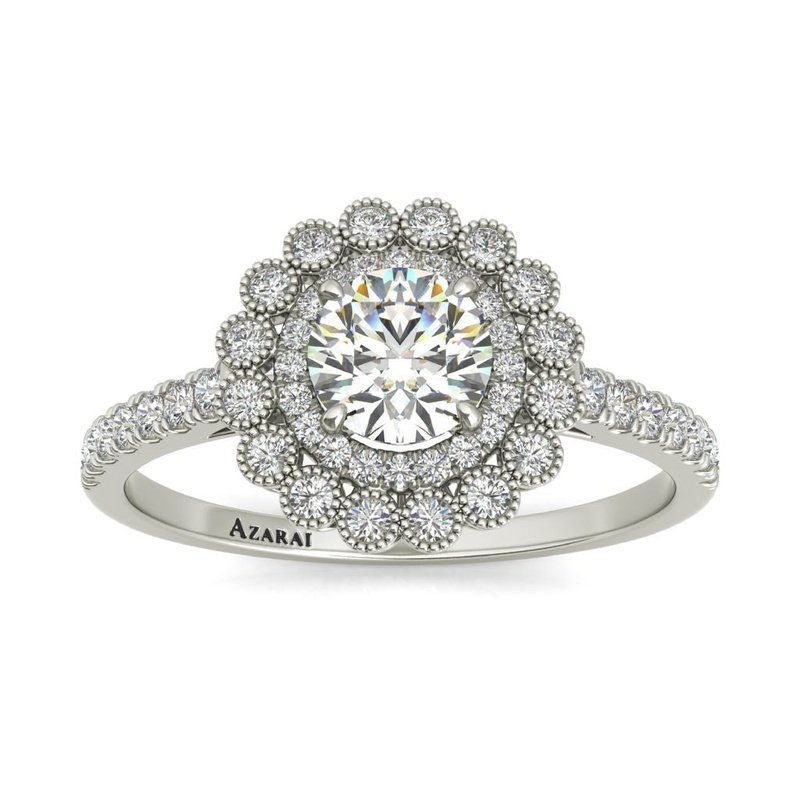 The Portia 14kt gold engagement ring features a stunning halo of diamonds in lustrous white gold.
