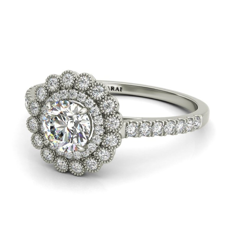 The Portia 14kt gold engagement ring is a stunning engagement ring featuring a diamond halo set in lustrous white gold.