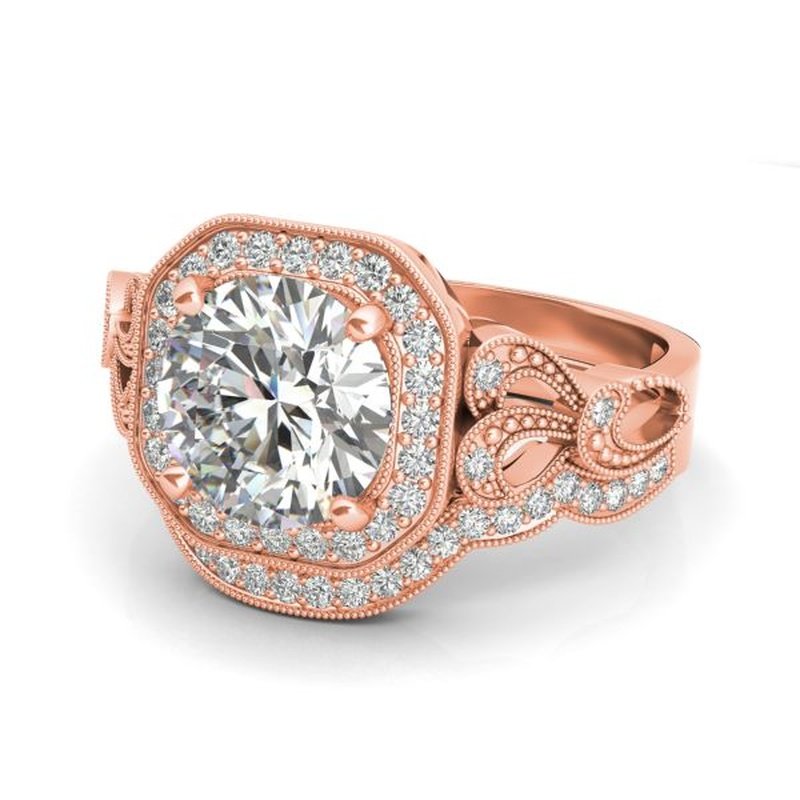 Rose gold Sage 9kt gold bridal set with a large central diamond surrounded by smaller diamonds in a detailed vintage design.