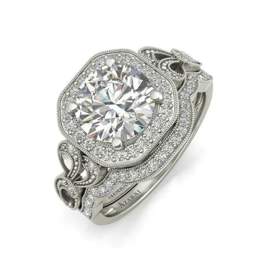 An elaborate Sage 9kt gold bridal set with a large central stone, surrounded by intricate metalwork and smaller diamonds, set on a white background.