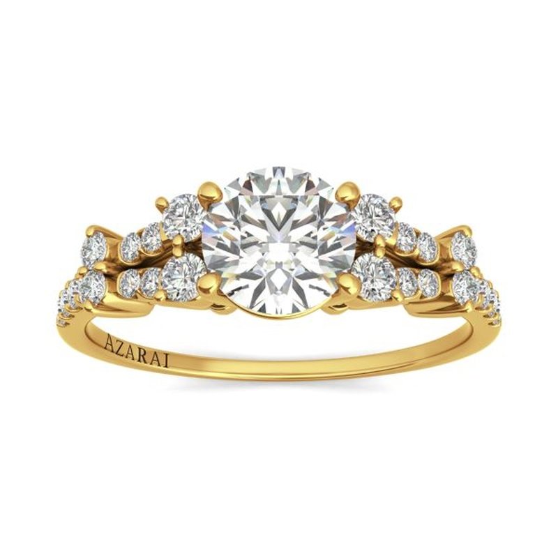 Sweetheart 9kt gold engagement ring featuring a central round diamond with smaller diamonds set along the band, bearing the inscription "sweetheart".