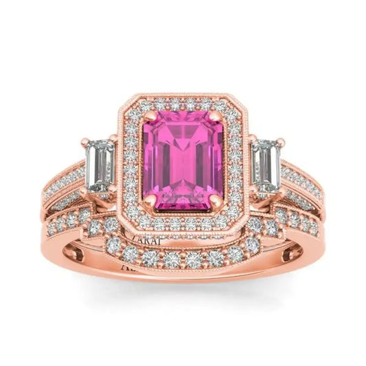A pink sapphire Tiffany 9kt gold bridal set with diamond accents, featuring baguette side stones and a halo design.