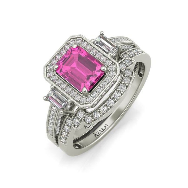 A pink sapphire and diamond bridal set by Tiffany, featuring a central rectangular pink stone surrounded by smaller diamonds on a silver band.