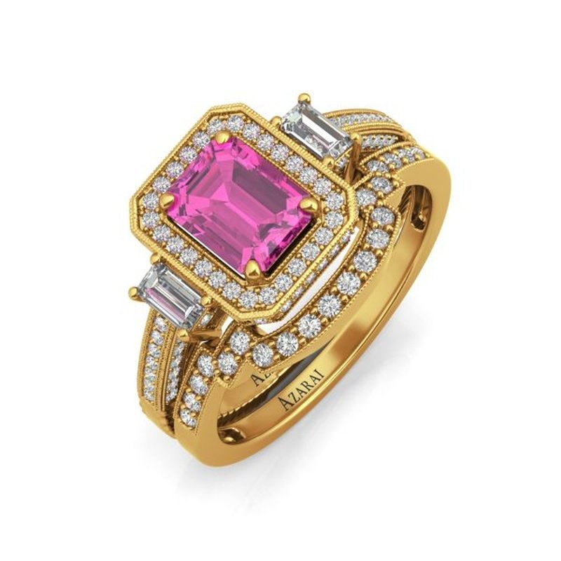 An elegant Tiffany 9kt gold bridal set featuring a central pink gemstone, surrounded by diamonds with additional baguette diamonds on the band.